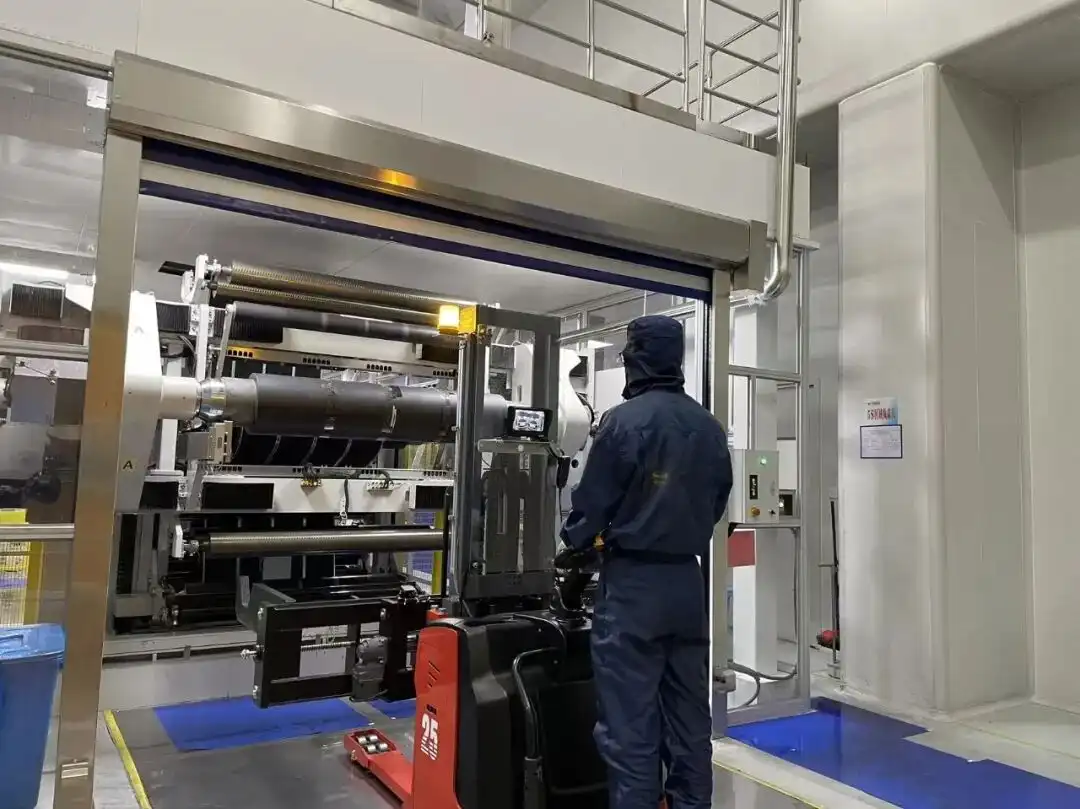 Frontline operator using a forklift to position roll material in the New Energy Battery Cell workshop